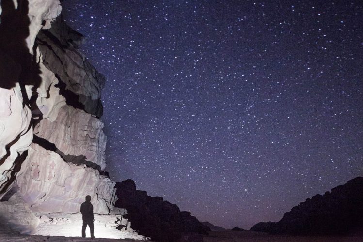 Slow exposure photo of stars in Wadi Rum desert
